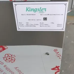samosa dumpling maker machine with kingsler machinery sticker on it