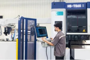 man working on computer based machine