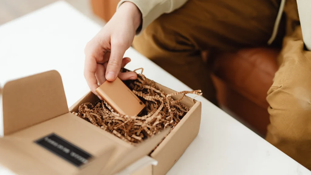 man packaging product with paper crinkle 